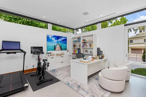 a bedroom with furniture and a potted plant