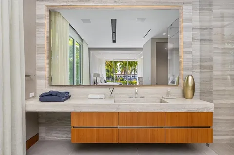 a living room with furniture a window and a flat screen tv