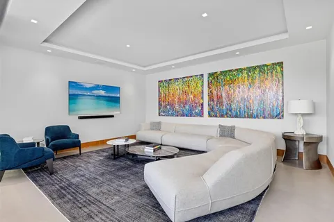 a room with furniture pool table and outdoor view