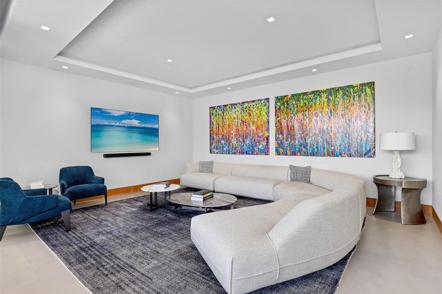 a room with furniture pool table and outdoor view