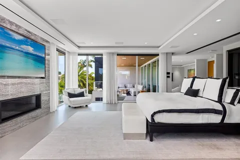 a living room with furniture and a view of kitchen