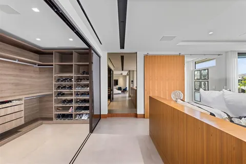 a view of a swimming pool with a patio and a fire pit