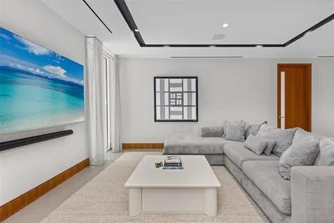 an aerial view of a house with yard swimming pool and outdoor seating