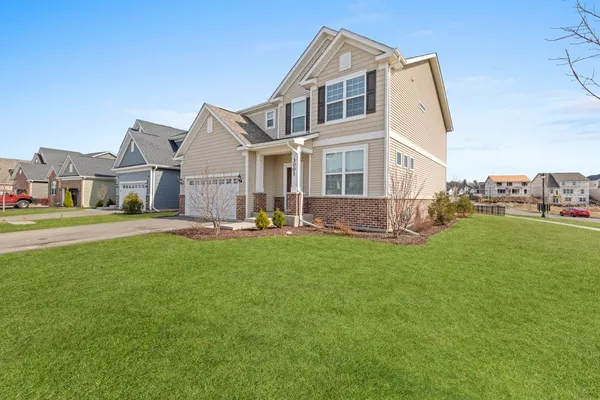 a front view of a house with a yard