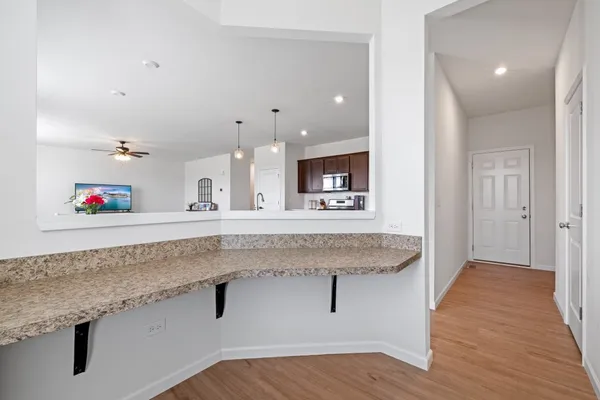 a spacious bathroom with a granite countertop sink