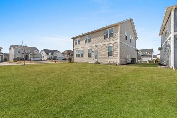 a view of a house with a big yard