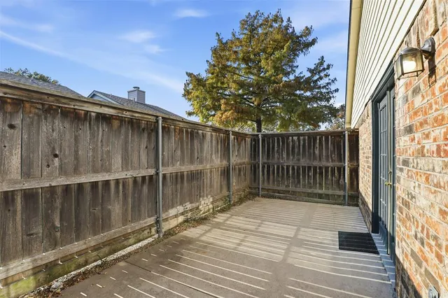 a balcony with wooden floor