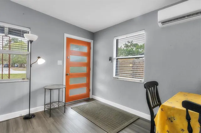 a view of room with window and wooden floor