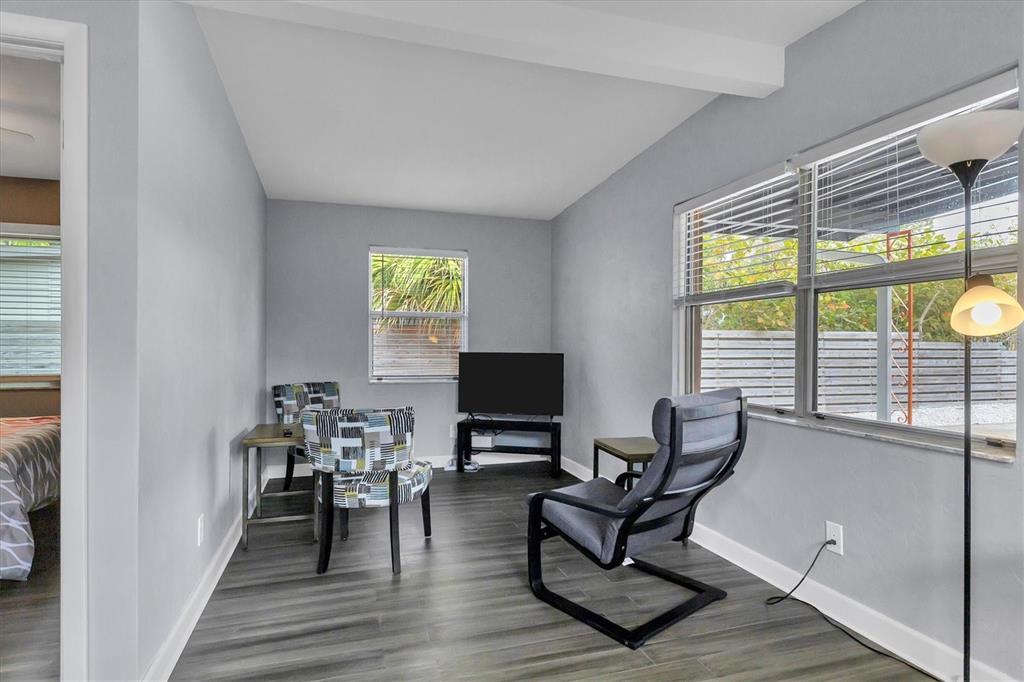 2305 Novus Street Sarasota, FL 34237 - Photo 13 of 28 a living room with furniture and a flat screen tv