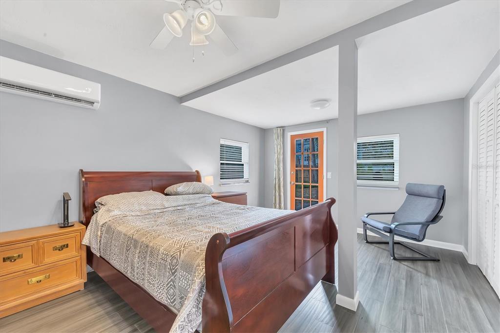 2305 Novus Street Sarasota, FL 34237 - Photo 10 of 28 a bedroom with a bed and wooden floor