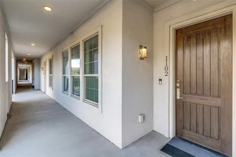 a view of a hallway with natural light