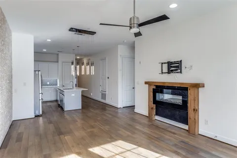 a view of an empty room and fire place