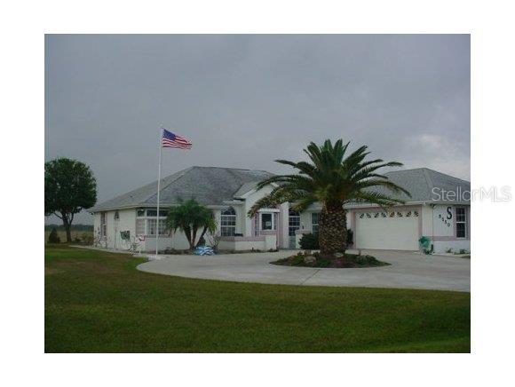 8550 Southwest 15th Street Okeechobee, FL 34974 - Photo 1 of 1 a house view with a garden space