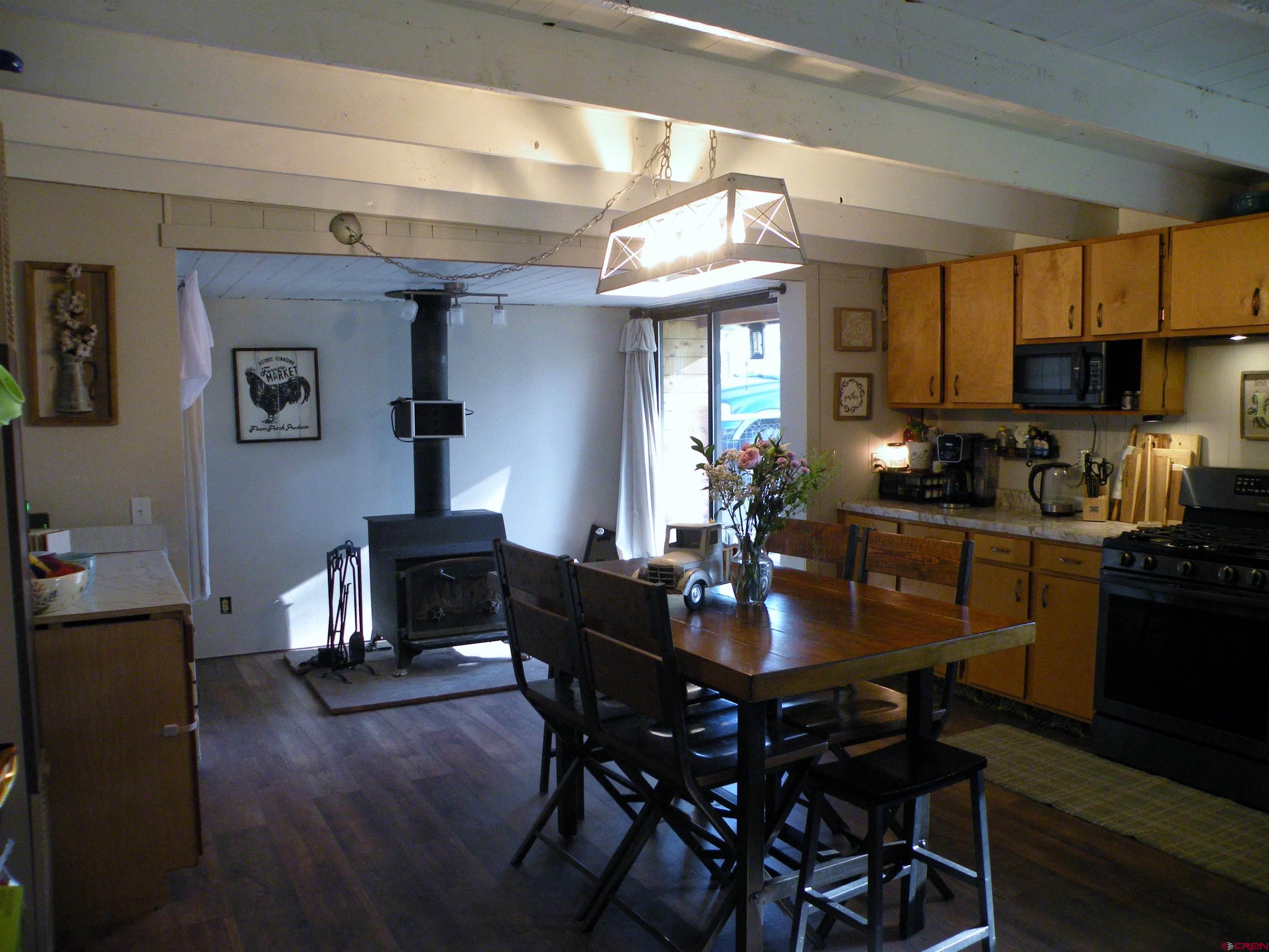 810 Grape Street Nucla, CO 81424 - Photo 19 of 31 a view of a dining room with furniture and wooden floor