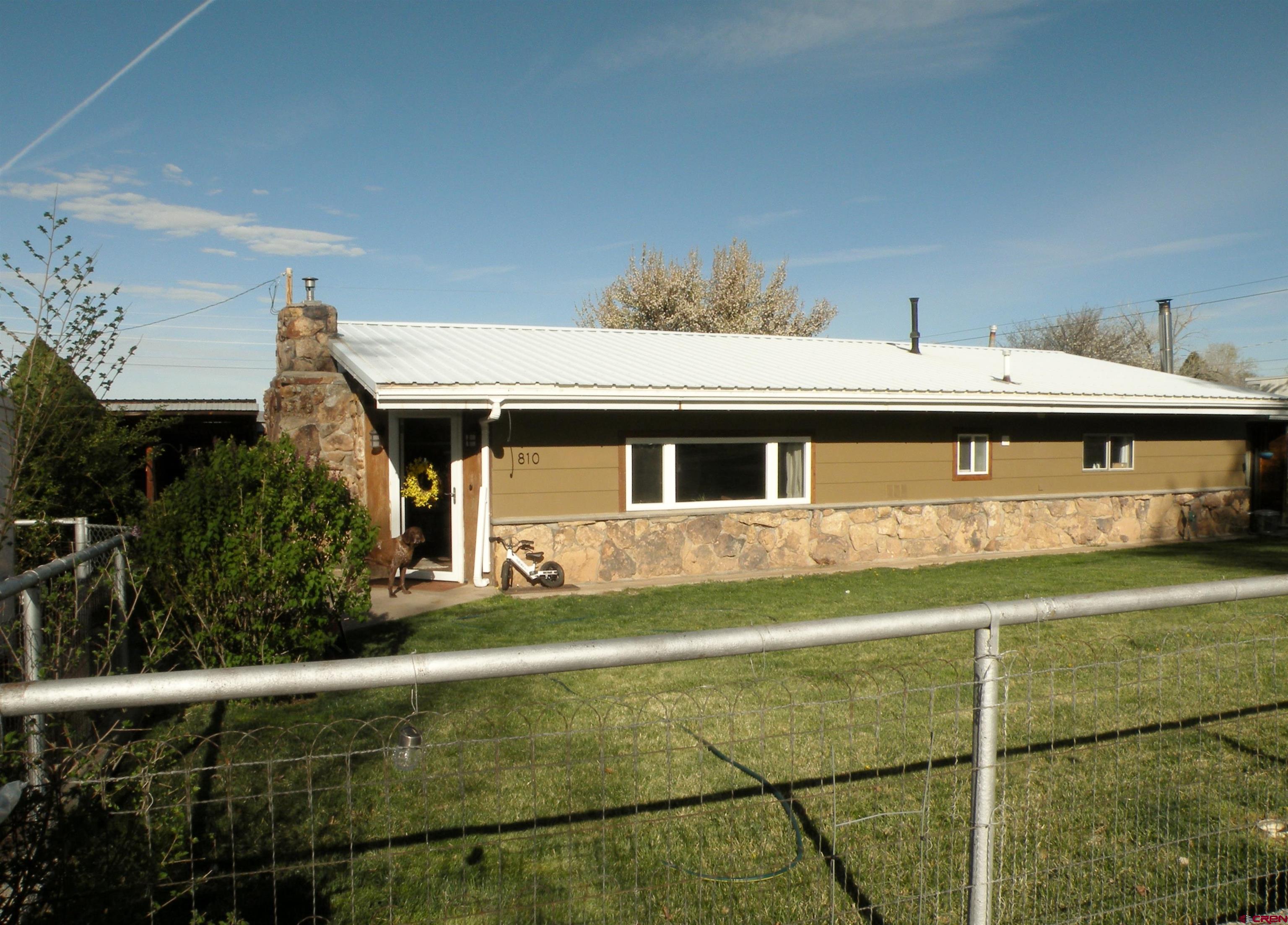 810 Grape Street Nucla, CO 81424 - Photo 2 of 31 a front view of a house with a garden