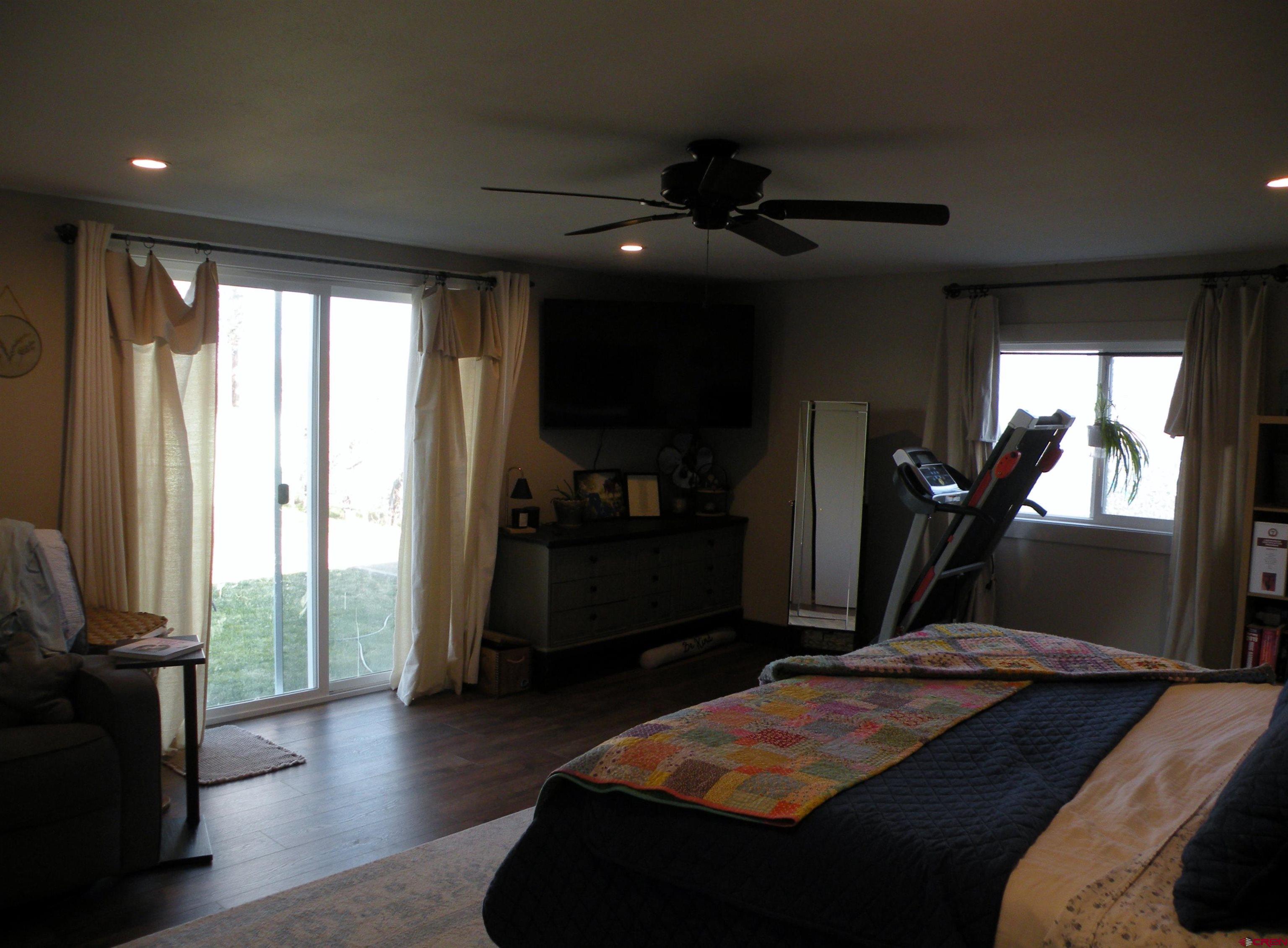 810 Grape Street Nucla, CO 81424 - Photo 21 of 31 a bed room with a bed and a television