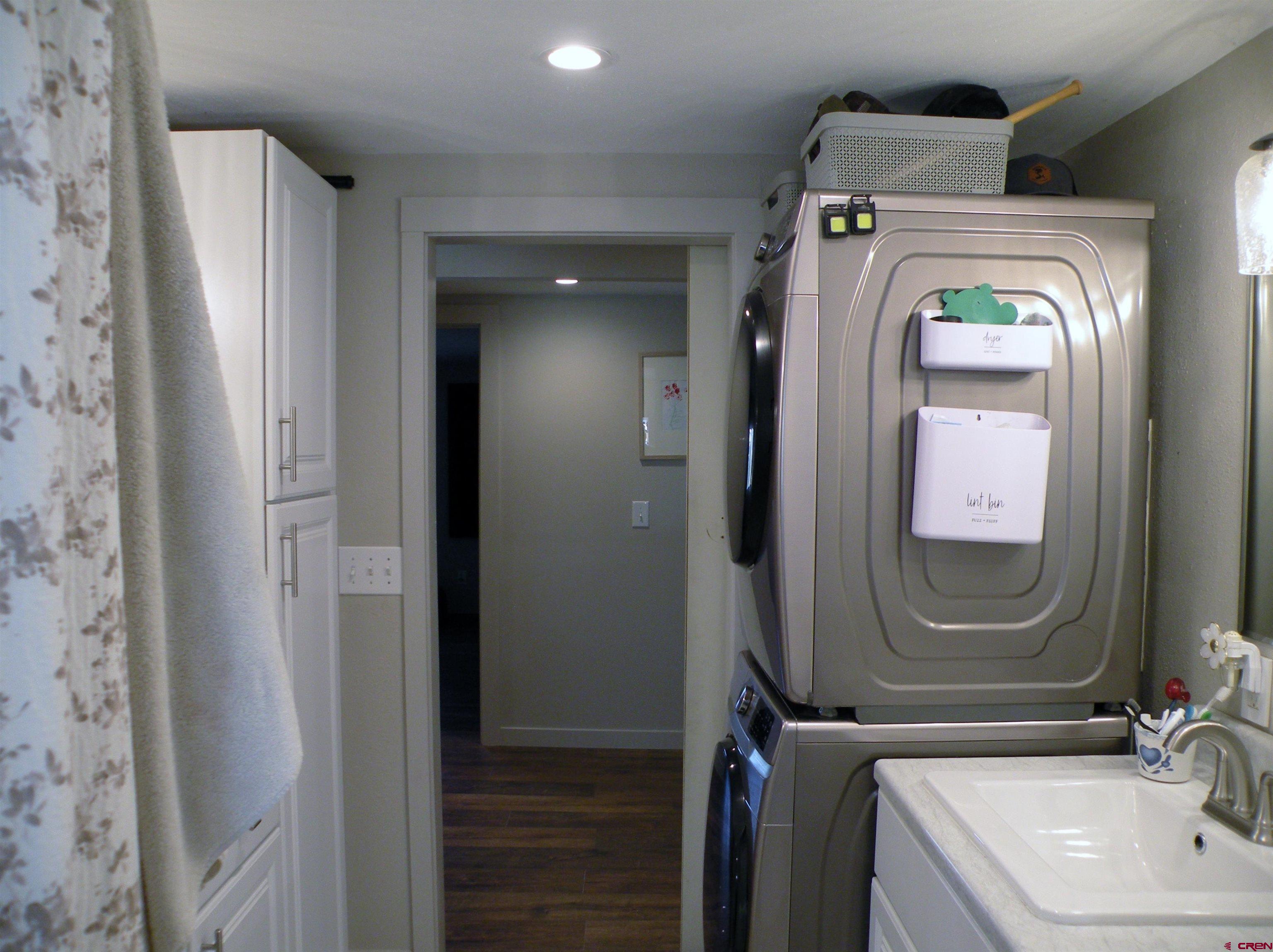 810 Grape Street Nucla, CO 81424 - Photo 25 of 31 a bathroom with a sink a mirror and shower
