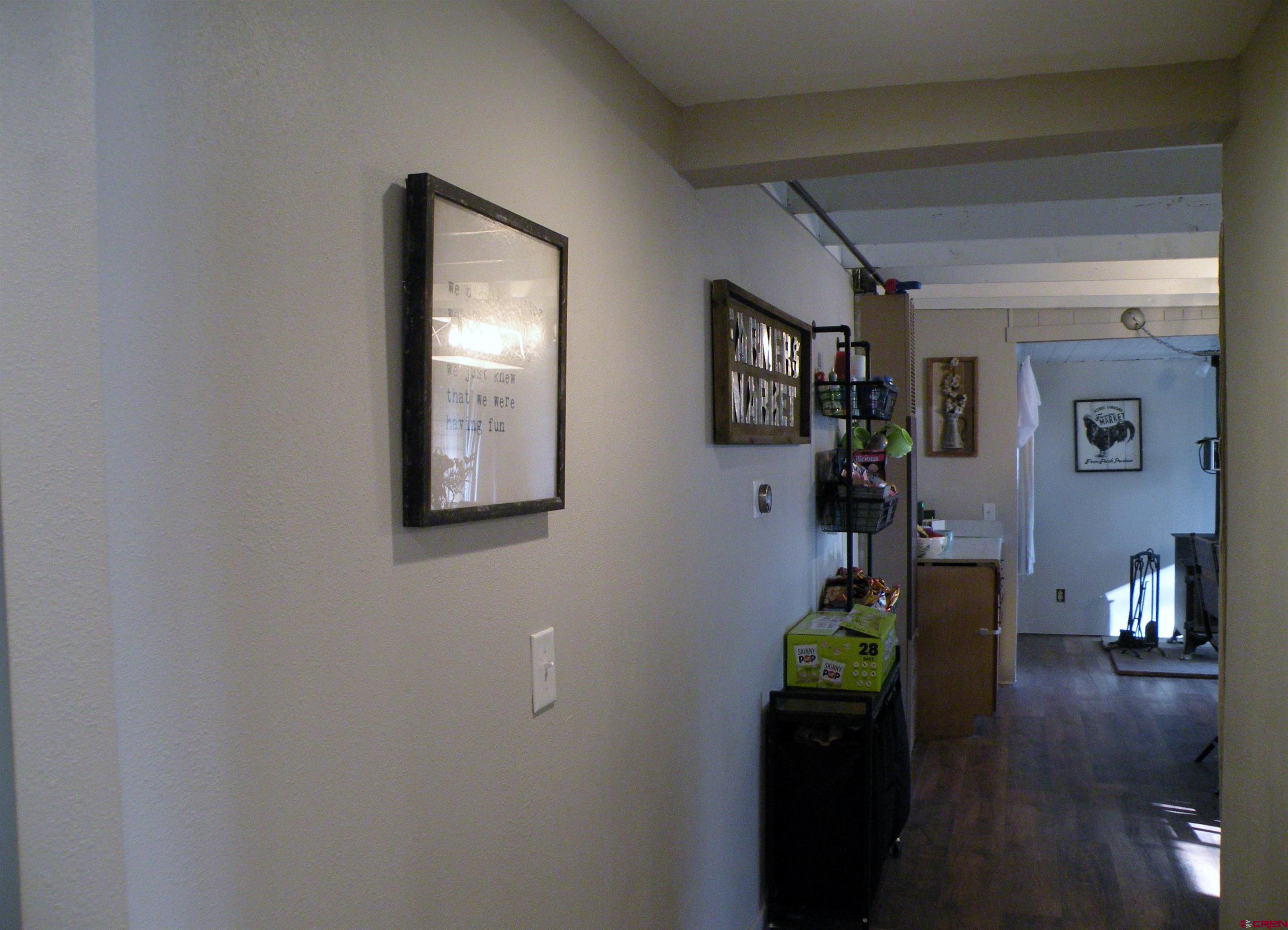 810 Grape Street Nucla, CO 81424 - Photo 26 of 31 a living room with furniture and a wooden floor