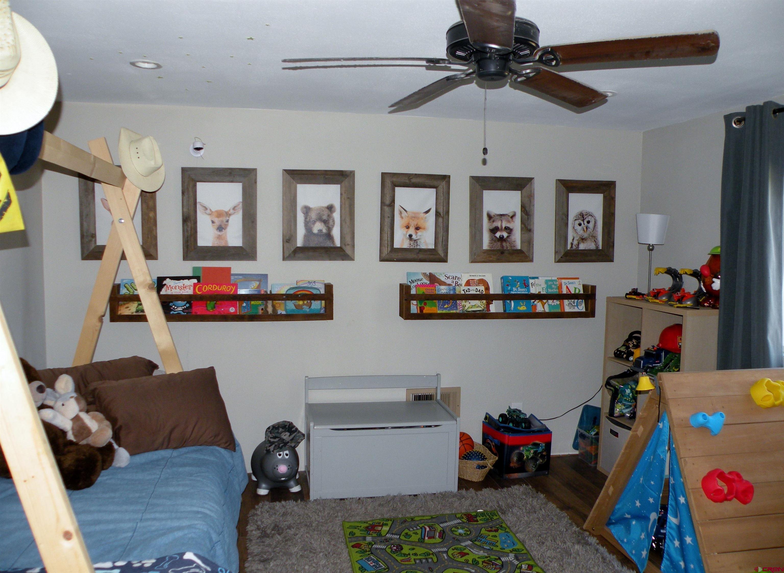 810 Grape Street Nucla, CO 81424 - Photo 27 of 31 a living room with furniture and a flat screen tv