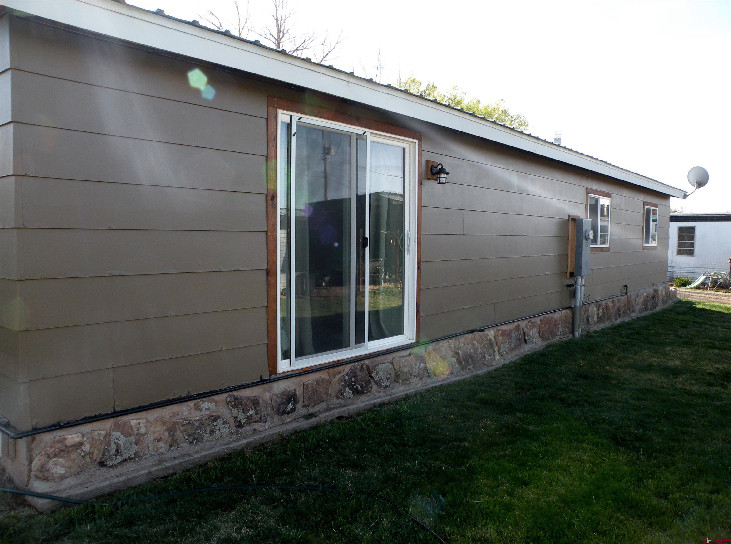810 Grape Street Nucla, CO 81424 - Photo 4 of 31 a backyard of a house with lots of green space