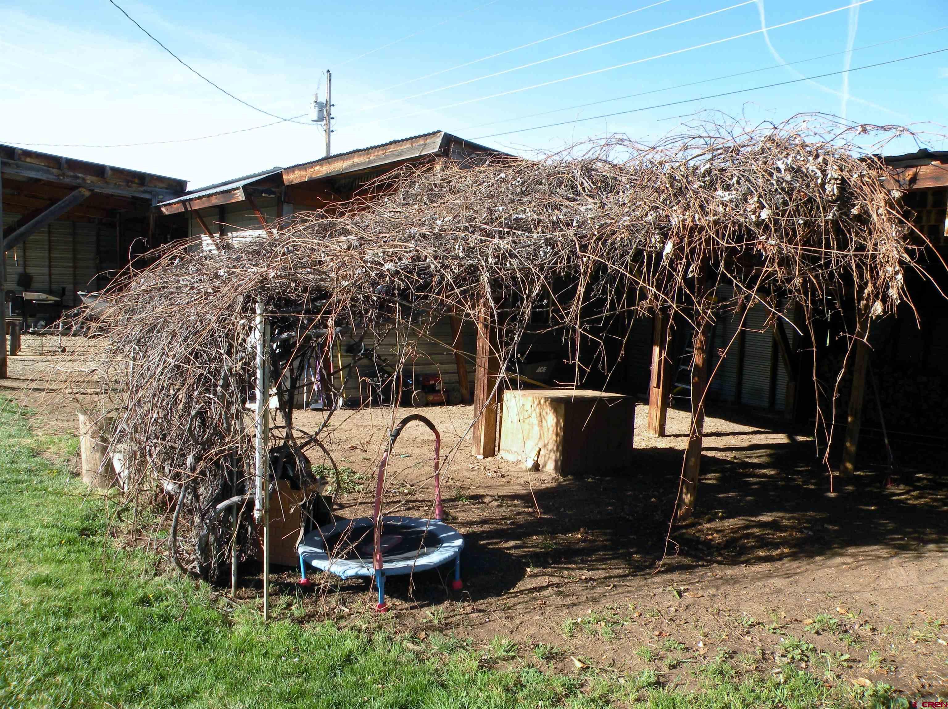 810 Grape Street Nucla, CO 81424 - Photo 9 of 31 a view of a chairs and table in backyard