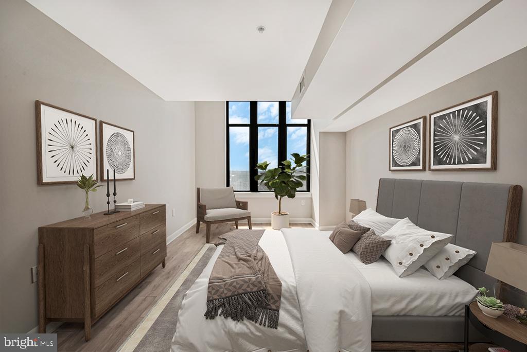 400 Massachusetts Avenue Northwest, Unit 1322 Washington, DC 20001 - Photo 21 of 37 a bedroom with a large bed couch and a window