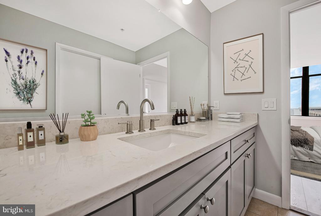 400 Massachusetts Avenue Northwest, Unit 1322 Washington, DC 20001 - Photo 23 of 37 a bathroom with a sink and a mirror