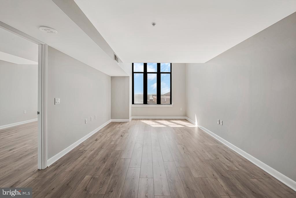 400 Massachusetts Avenue Northwest, Unit 1322 Washington, DC 20001 - Photo 29 of 37 wooden floor in an empty room