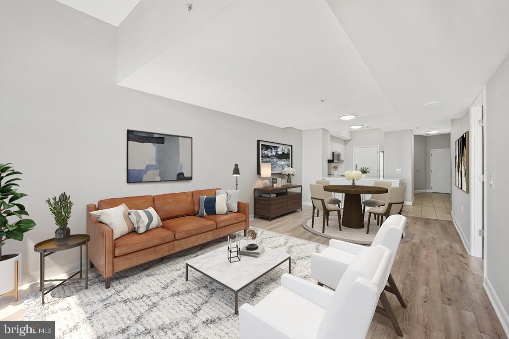 400 Massachusetts Avenue Northwest, Unit 1322 Washington, DC 20001 - Photo 10 of 37 a living room with furniture and a table