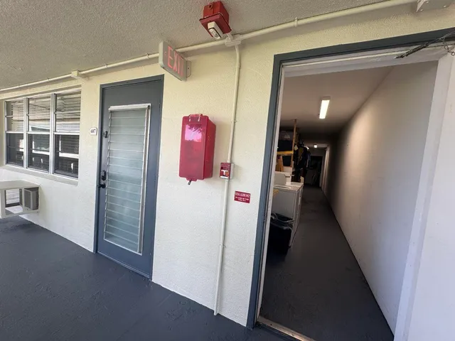 a kitchen with a sink a refrigerator and a window
