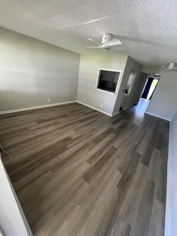 a white toilet sitting next to a bathroom sink and vanity