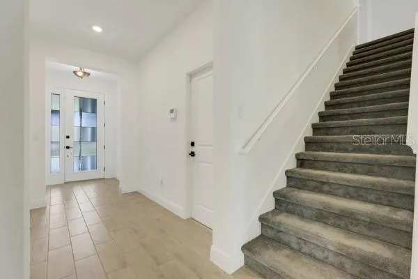 a view of an entryway with wooden floor
