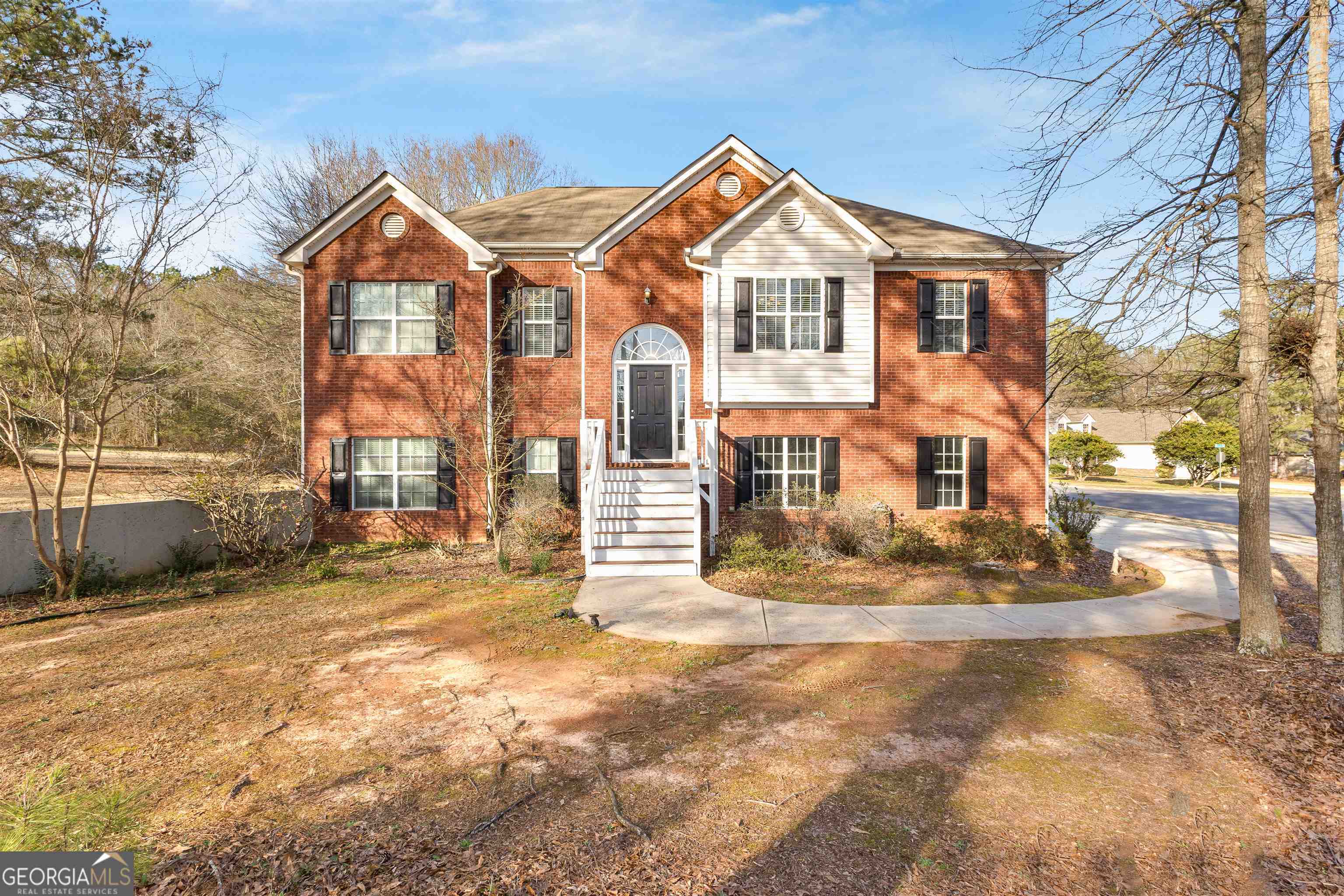a front view of a house with a yard