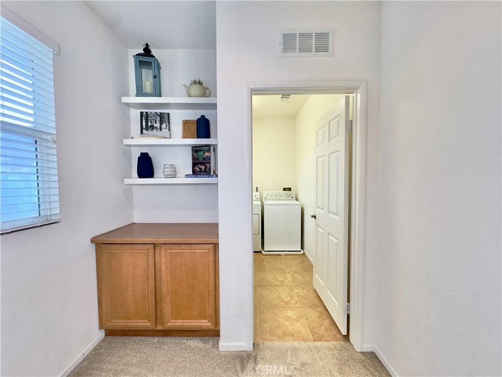 11265 Runyan Road Beaumont, CA 92223 - Photo 55 of 138 a view of a bathroom from the hallway