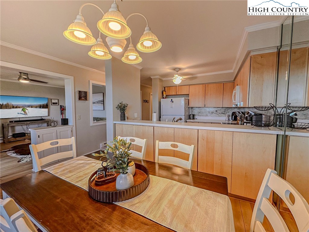 301 Pinnacle Inn Road, Unit 3320 Beech Mountain, NC 28604 - Photo 12 of 45 a kitchen with stainless steel appliances granite countertop a sink and cabinets