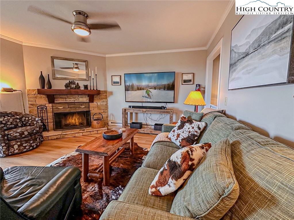 301 Pinnacle Inn Road, Unit 3320 Beech Mountain, NC 28604 - Photo 15 of 45 a bed room with furniture and a fireplace