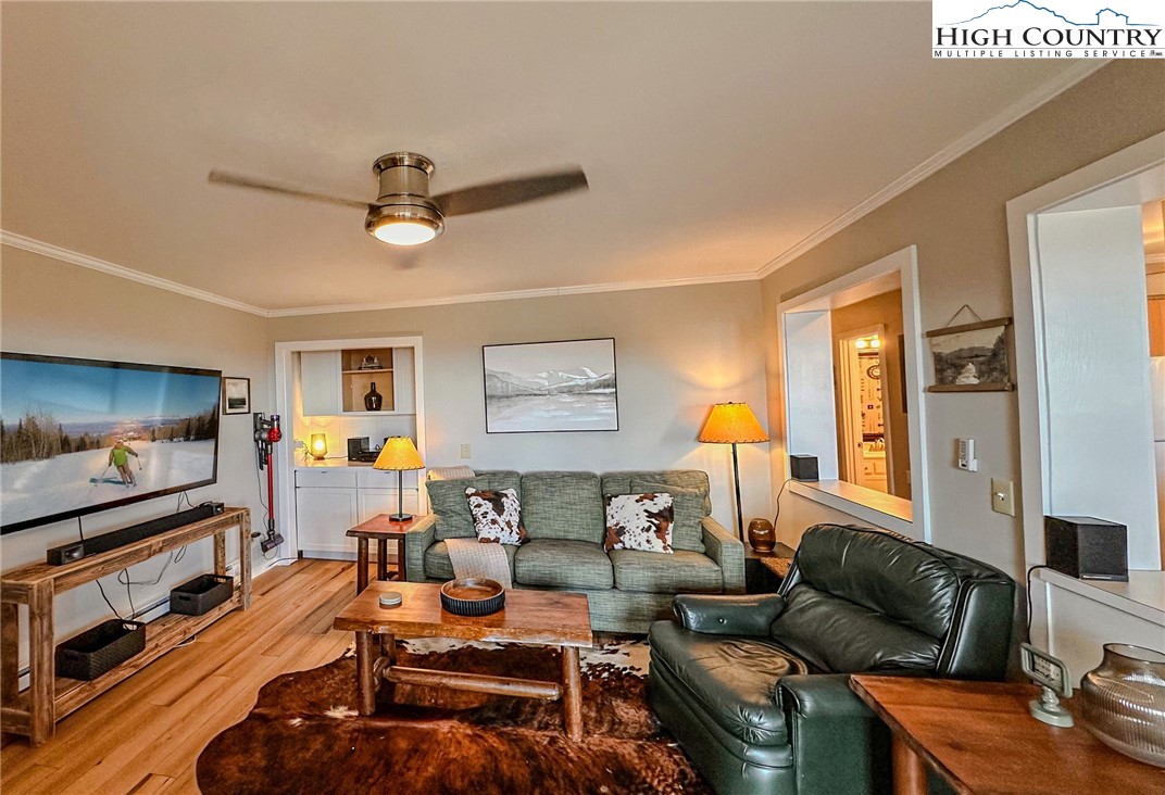 301 Pinnacle Inn Road, Unit 3320 Beech Mountain, NC 28604 - Photo 16 of 45 a living room with furniture and a flat screen tv
