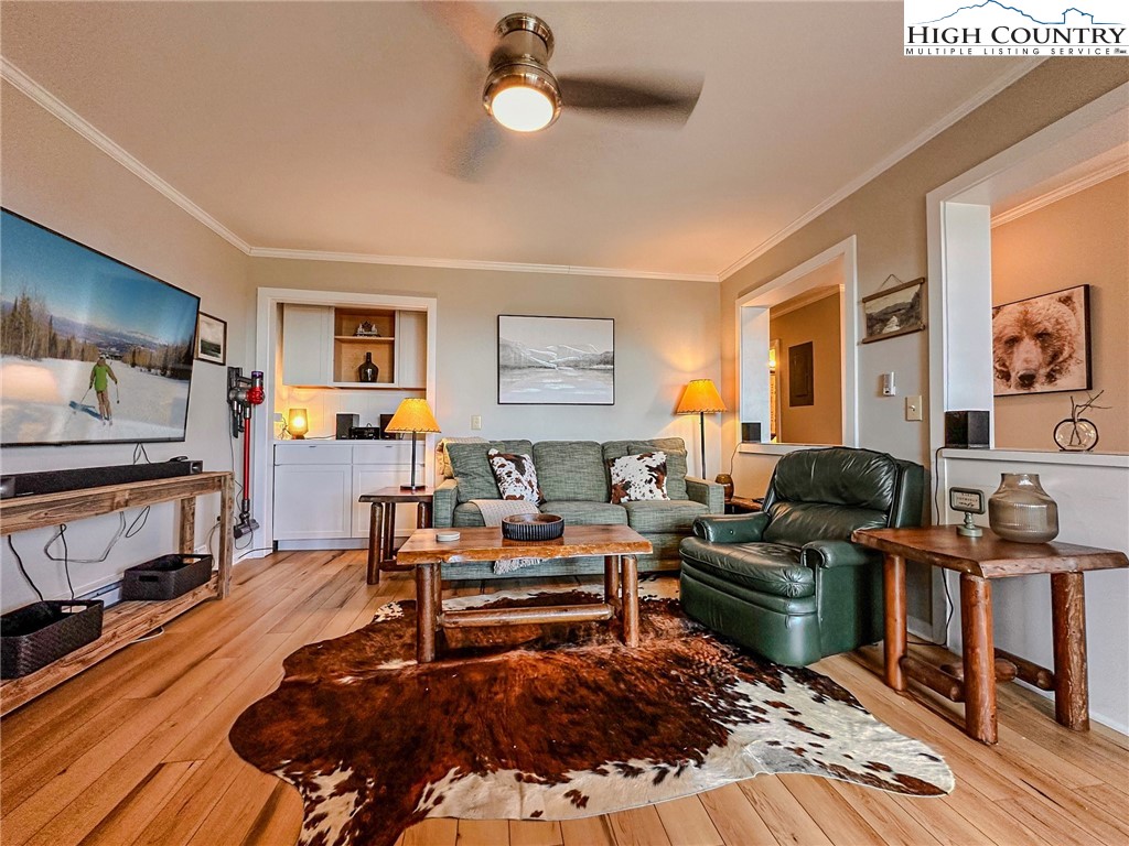 301 Pinnacle Inn Road, Unit 3320 Beech Mountain, NC 28604 - Photo 18 of 45 a living room with furniture and a flat screen tv