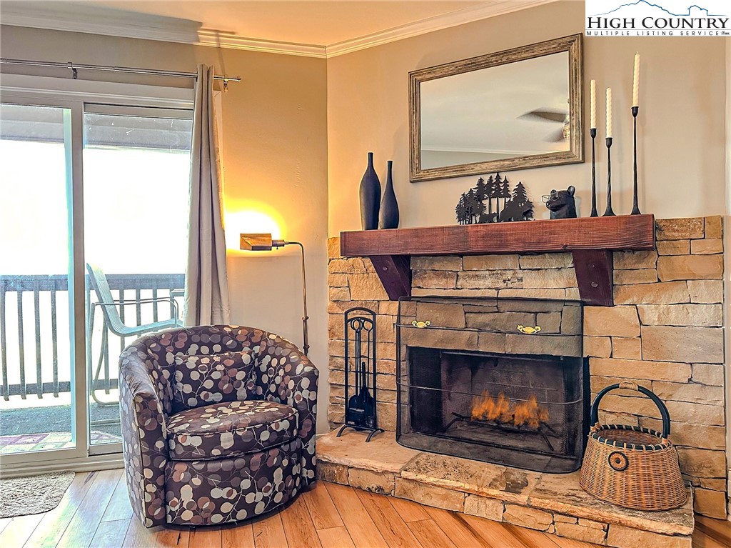 301 Pinnacle Inn Road, Unit 3320 Beech Mountain, NC 28604 - Photo 19 of 45 a living room with furniture and a fireplace