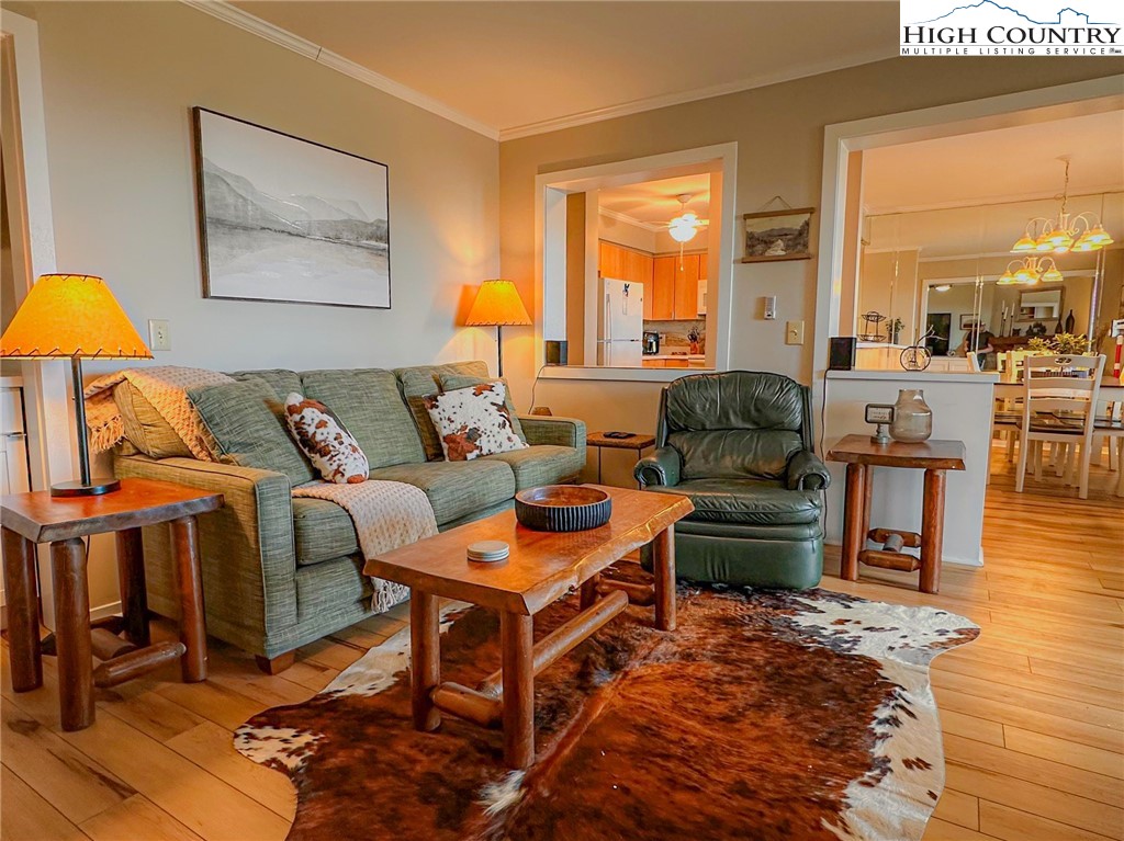 301 Pinnacle Inn Road, Unit 3320 Beech Mountain, NC 28604 - Photo 20 of 45 a living room with furniture and a table