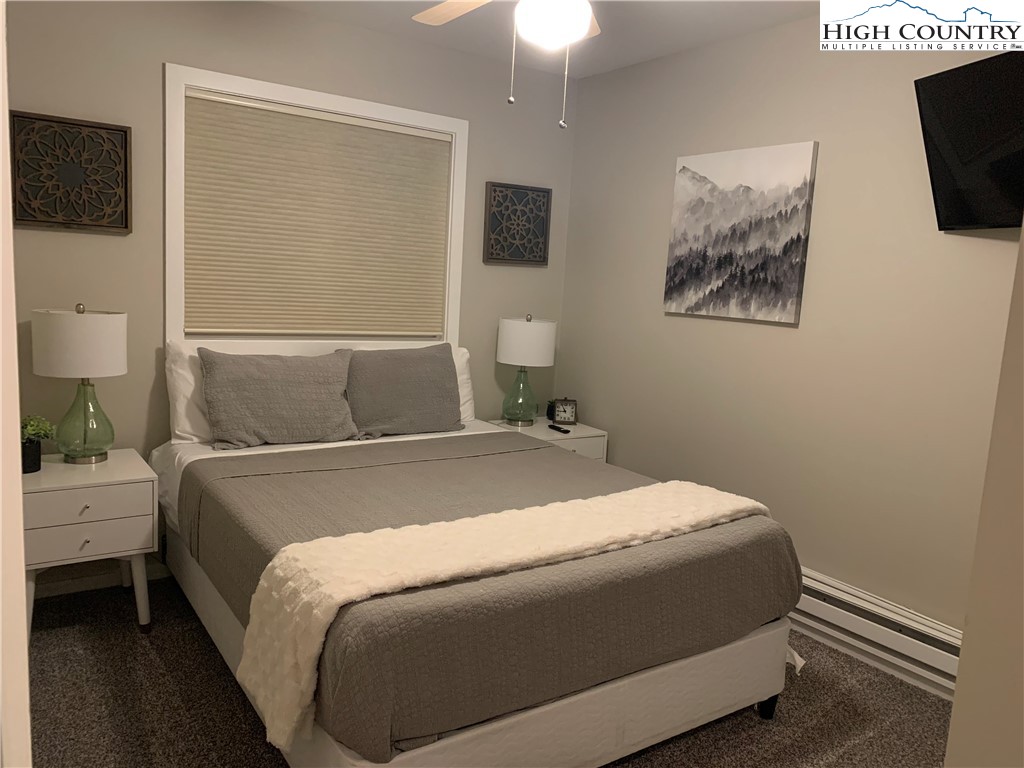 301 Pinnacle Inn Road, Unit 3320 Beech Mountain, NC 28604 - Photo 24 of 45 a bedroom with a bed and a window