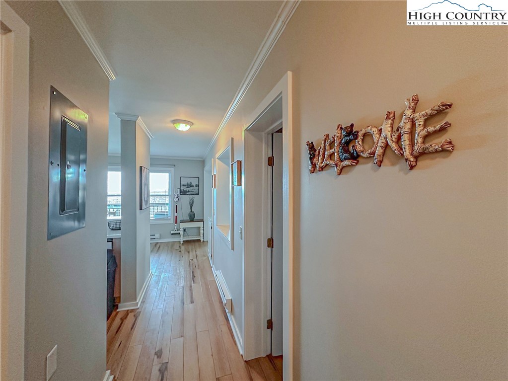 301 Pinnacle Inn Road, Unit 3320 Beech Mountain, NC 28604 - Photo 27 of 45 a view of a hallway with wooden floor and a bathroom