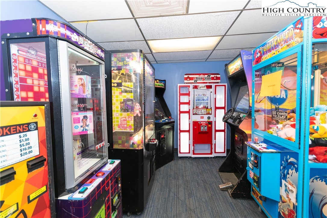 301 Pinnacle Inn Road, Unit 3320 Beech Mountain, NC 28604 - Photo 33 of 45 a living room with furniture and a flat screen tv