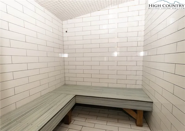 a view of a swimming pool with a kitchen