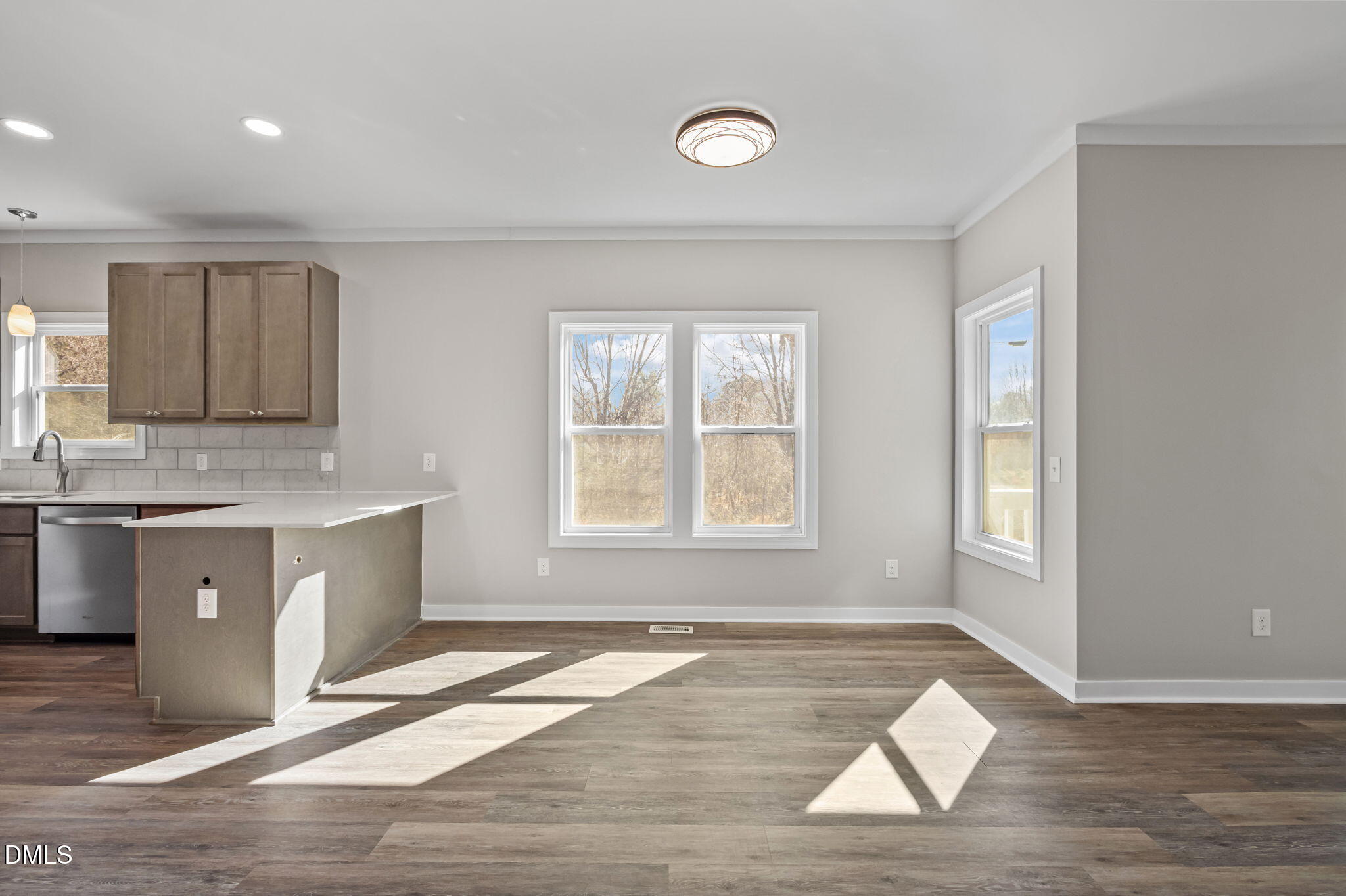 1108 Shelton Road Roxboro, NC 27573 - Photo 11 of 27 a view of an empty room with wooden floor and a window