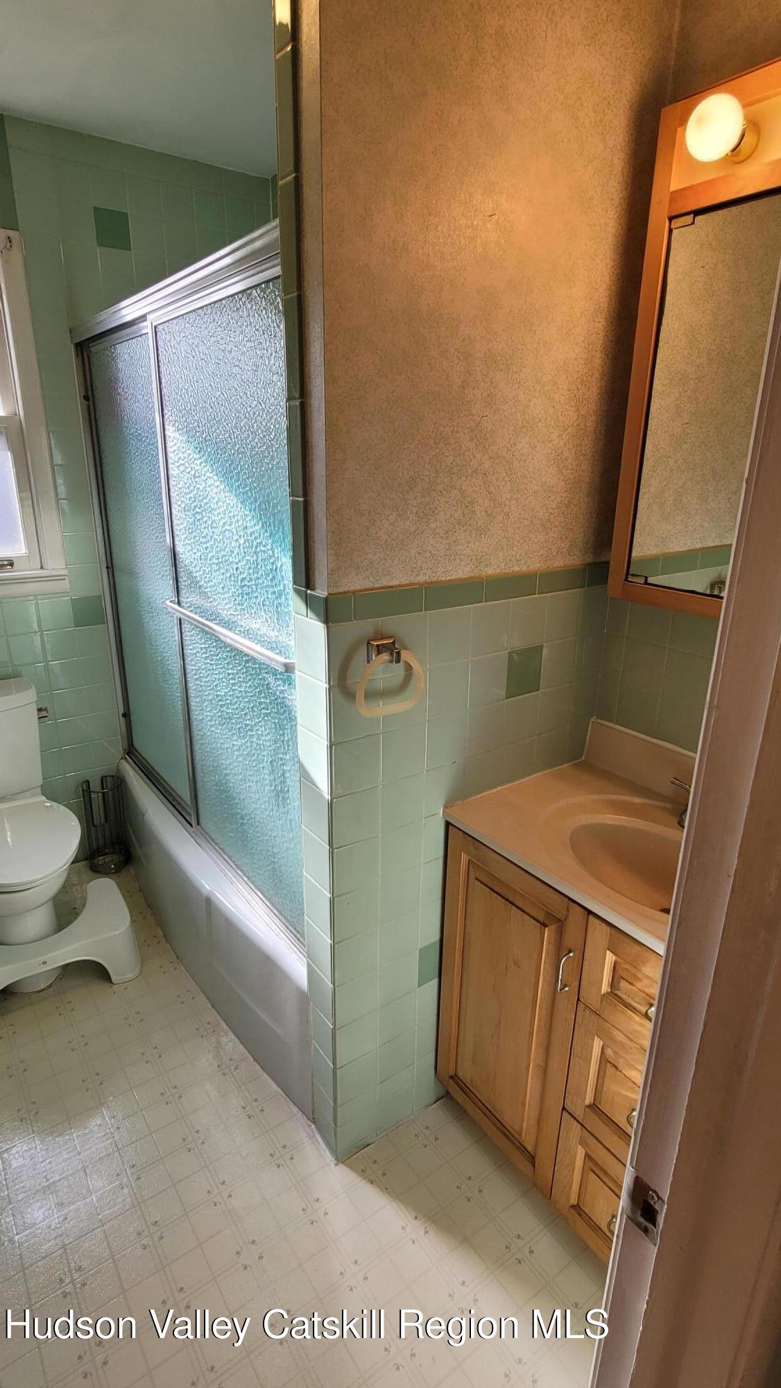 97 Ruby Road Kingston, NY 12401 - Photo 23 of 25 a bathroom with a tub and toilet