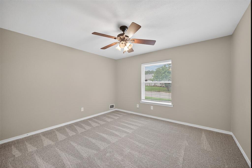 9660 Timberleaf Drive Dallas, TX 75243 - Photo 21 of 40 Neutral-toned walls complement patterned carpeting