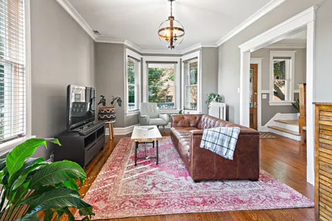 a living room with furniture rug and window