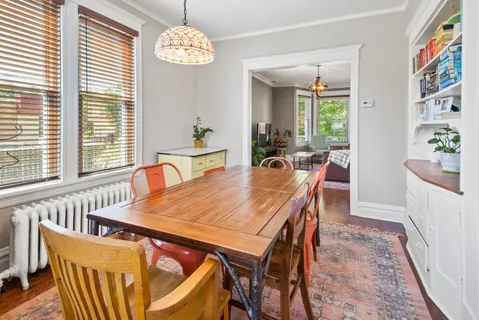 a view of a dining room with furniture window and outside view