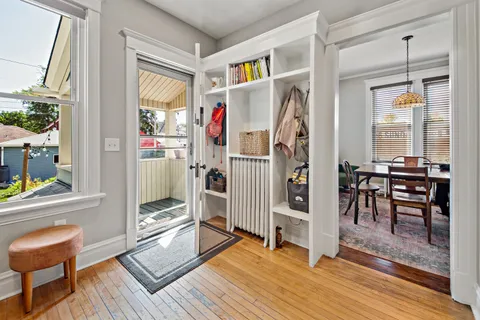 a view of a livingroom with furniture and windows